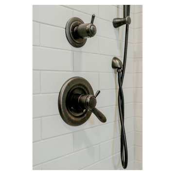 Aged Pewter Shower Fixtures and Delta Monitor Trim in Subway Tile Shower