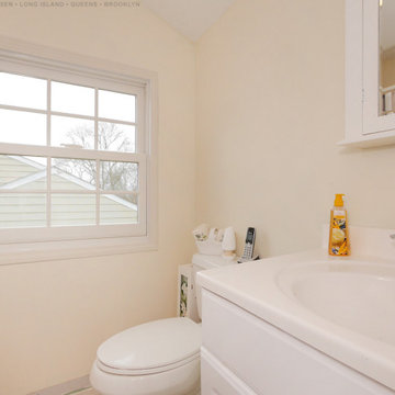 Charming Bathroom with New White Window - Renewal by Andersen Long Island