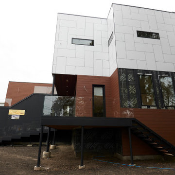 Bold Modern Silhouette with Contrasting Volumes and Materials