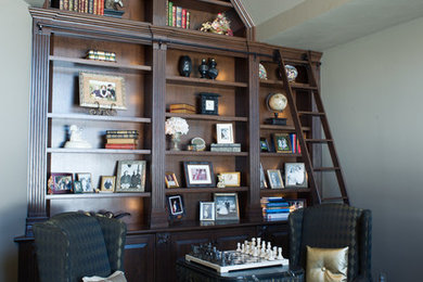 Study room - mid-sized traditional dark wood floor and black floor study room idea in Chicago with gray walls