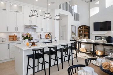 Example of a transitional living room design in Vancouver with white walls