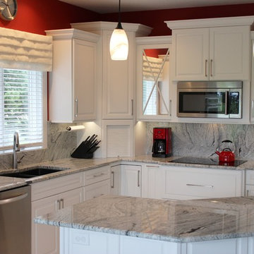 Geneseo, IL- Painted White Kitchen With Mirrored Cabinets and Full-Height Splash