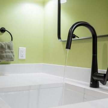 Black Matte Faucet and White Farmhouse Sink in Modern Basement Bath