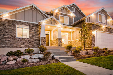 Example of a large arts and crafts beige two-story concrete fiberboard exterior home design in Salt Lake City