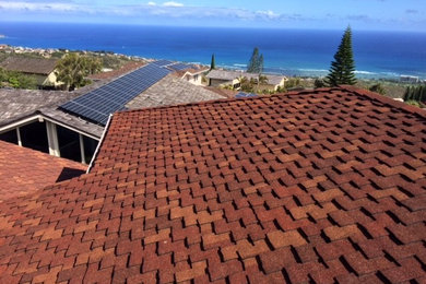 Inspiration for a large contemporary red two-story exterior home remodel in Hawaii