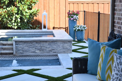 Mid-sized elegant backyard concrete paver and rectangular pool photo in Dallas