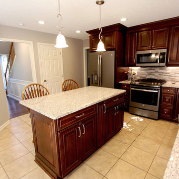 Waypoint Cherry Chocolate Cabinets and Giallo Ornamental Granite Countertops