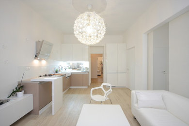 Open concept kitchen - contemporary l-shaped vinyl floor open concept kitchen idea in Other with a single-bowl sink, laminate countertops, white backsplash, glass sheet backsplash, white appliances and an island