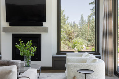 Inspiration for a mid-sized contemporary open concept medium tone wood floor family room remodel in Sacramento with white walls, a standard fireplace and a wall-mounted tv