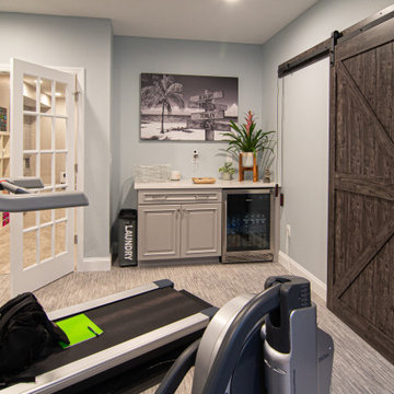 Basement With Entertainment Area for Family With Traditional Style Kitchenette