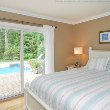 Pretty Bedroom with Sliding Glass Patio Door - Renewal by Andersen New Jersey /