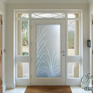 Inspiration for a large eclectic front door in Other with white walls, ceramic floors, a single front door and a glass front door.