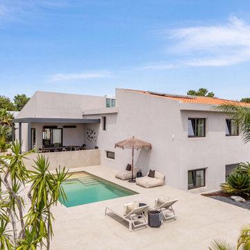 Exterior aerial view of white house and pool, Alfragide