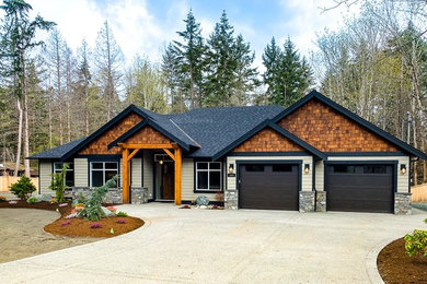 Inspiration for a large timeless beige one-story mixed siding exterior home remodel in Other with a shingle roof