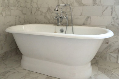 Inspiration for a large transitional 3/4 gray tile and marble tile marble floor and gray floor bathroom remodel in Phoenix with shaker cabinets, white cabinets, a two-piece toilet, gray walls, an undermount sink and granite countertops