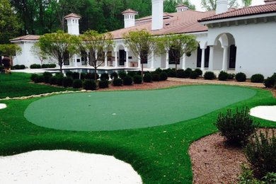 Photo of a mid-sized traditional partial sun backyard outdoor basketball/tennis/multi-game court in Charlotte.