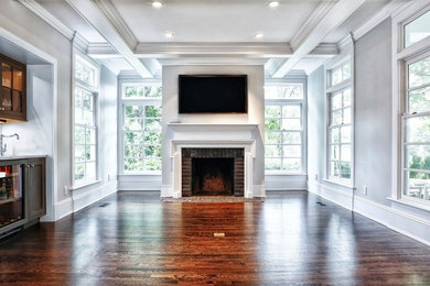 Family room - traditional family room idea in New York with a standard fireplace