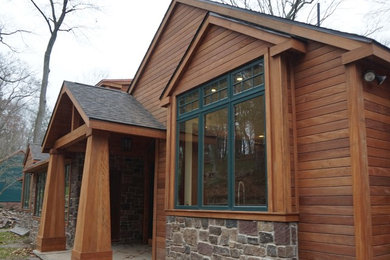 Large rustic brown two-story wood gable roof idea in Philadelphia