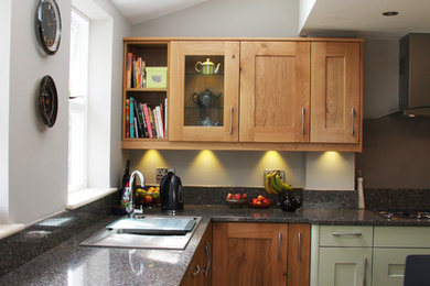 Design ideas for a medium sized modern u-shaped kitchen in Other with medium wood cabinets, ceramic flooring and no island.