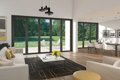 Large minimalist open concept medium tone wood floor living room photo in DC Metro with white walls, no fireplace and no tv