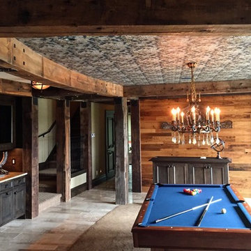 Hand Hewn Timbers & Reclaimed Wood Paneling in a Basement Game Room