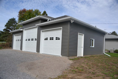 Inspiration for a large three-car garage remodel in Other