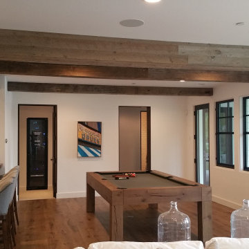 Reclaimed Wood Box Beams and Timber Posts in a Modern Home Bar & Game Room