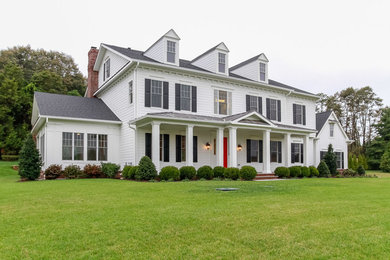 Example of a large classic white two-story concrete fiberboard gable roof design in Baltimore