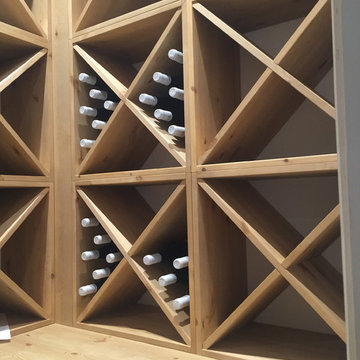 Compact wine room in Henley on Thames using case racks, cubes and shelves