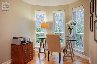 Inspiration for a mid-sized contemporary freestanding desk light wood floor study room remodel in New York with beige walls