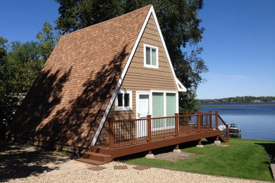 Small elegant brown two-story wood exterior home photo in Denver with a shingle roof