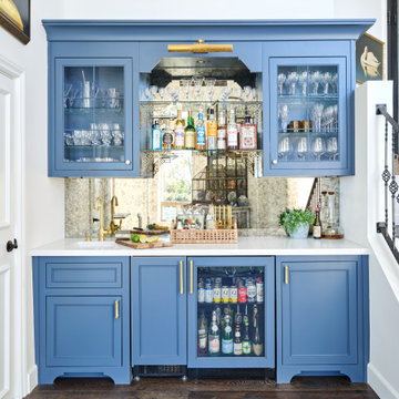 Custom Built-In Bar with Blue Cabinetry and Brass Accents