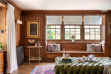 Photo of a medium sized classic formal enclosed living room in Berkshire with brown walls, dark hardwood flooring, brown floors and wood walls.