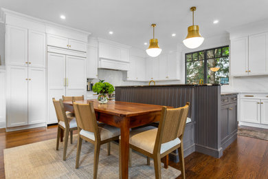 Inspiration for a large transitional open concept medium tone wood floor and wallpaper living room remodel in New York with white walls, a standard fireplace, a stone fireplace and a wall-mounted tv