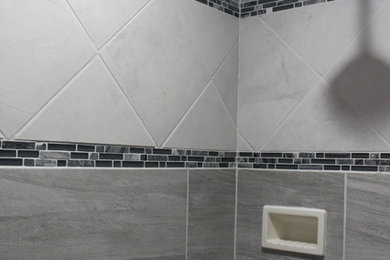 Doorless shower - contemporary master blue tile and glass tile ceramic tile doorless shower idea in Other with an integrated sink, onyx countertops, a one-piece toilet and gray walls