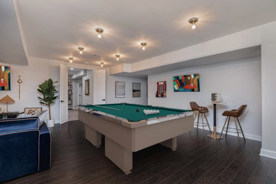 Large trendy dark wood floor and brown floor basement game room photo in Indianapolis with white walls