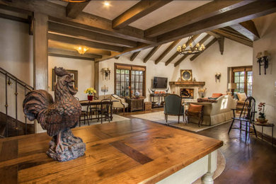 Open concept kitchen - mid-sized craftsman u-shaped medium tone wood floor and brown floor open concept kitchen idea in Other with a farmhouse sink, recessed-panel cabinets, medium tone wood cabinets, brown backsplash, stone tile backsplash, paneled appliances, an island and beige countertops