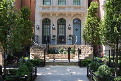 Photo of a small traditional courtyard partial sun formal garden for summer in Chicago with a garden path and natural stone pavers.