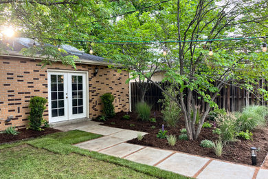 Inspiration for a contemporary privacy and partial sun backyard formal garden in Denver.