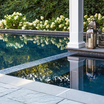 glass tile spa spilling into the pool