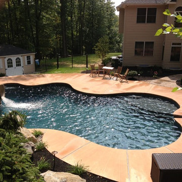 Stroud Township salt water pool with spa, sunshelf, slide, and waterfall