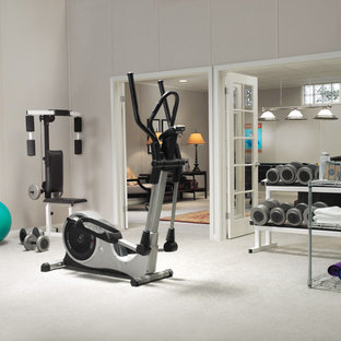 Design ideas for a medium sized modern basement in Boston with grey walls, carpet and white floors.