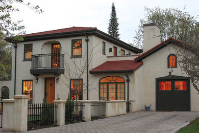 Inspiration for a large mediterranean white two-story stucco exterior home remodel in Other