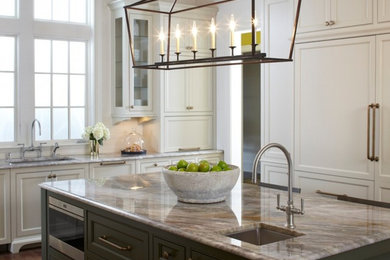 Example of a large transitional u-shaped medium tone wood floor and brown floor open concept kitchen design in Dallas with an undermount sink, shaker cabinets, white cabinets, granite countertops, white backsplash, subway tile backsplash, stainless steel appliances and an island