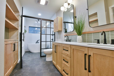 Bathroom - master white tile and ceramic tile porcelain tile, black floor and double-sink bathroom idea in Austin with shaker cabinets, light wood cabinets, an undermount sink, quartz countertops, a hinged shower door, white countertops, a niche and a built-in vanity