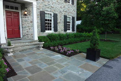 Inspiration for a large transitional slate floor entryway remodel in DC Metro with a red front door