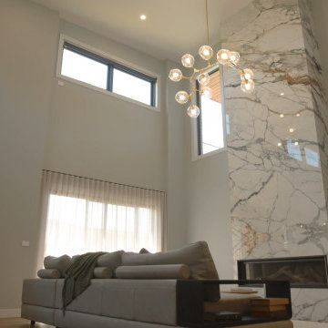 Sheer curtains in a double-height living room – Bathurst