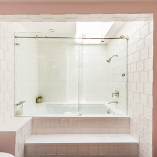 Inspiration for a traditional master bathroom in Los Angeles with an alcove tub, a shower/bathtub combo, white tile, pink walls, a sliding shower screen and ceramic tile.