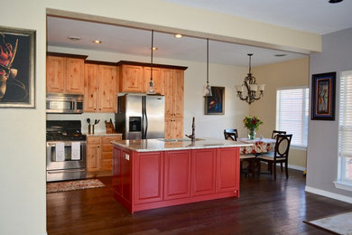 Mid-sized arts and crafts l-shaped dark wood floor and brown floor open concept kitchen photo in Albuquerque with an undermount sink, raised-panel cabinets, light wood cabinets, marble countertops and an island