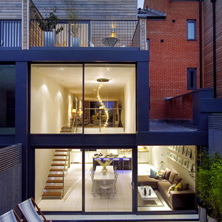 Inspiration for a modern glass terraced house in London with three floors.